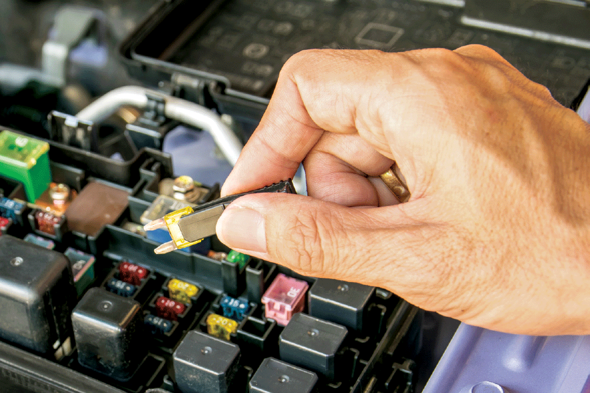 Narva automotive fuse being picked out of car engine bay